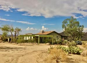 a green house in the middle of a field at Joshua Tree Dream Weaver hot tub & National Park in Joshua Tree