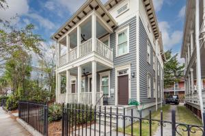 a house with a porch and a fence at Secluded Courtyard & Parking - 2 Blocks to King in Charleston