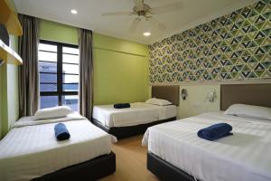 a hotel room with two beds and a window at KK Vacation Apartments-Marina Court - STAY AND GET CASH REBATE in Kota Kinabalu +110 photos