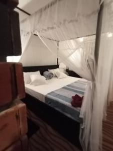 Postel nebo postele na pokoji v ubytování 4s Heaven