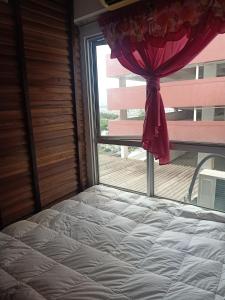 a bedroom with a bed and a window at Sky Chalet at Axis Next To LRT Pandan Indah Ampang in Ampang