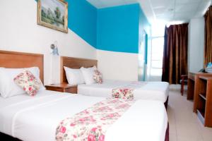 Katil atau katil-katil dalam bilik di HOTEL D VIEW MERSING