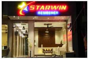 a starlin restaurant with a sign on the front of it at Starwin Residency in Rāmanāthapuram