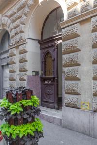 a wooden door on the side of a building at Deluxe Izabella Apartment in the Center of Budapest in Budapest