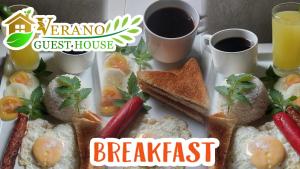 a plate of breakfast food with two cups of coffee at Verano GuestHouse in Tagbilaran City +27 photos