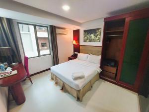 Postel nebo postele na pokoji v ubytování Celyn City Hotel