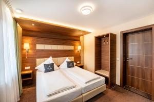 Ένα ή περισσότερα κρεβάτια σε δωμάτιο στο Aspire Castillo Reutlingen, Trademark Collection by Wyndham