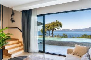 a house with a view of the ocean at Villa Bianca with Sea View in Ovacik