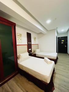 Postel nebo postele na pokoji v ubytování Celyn City Hotel