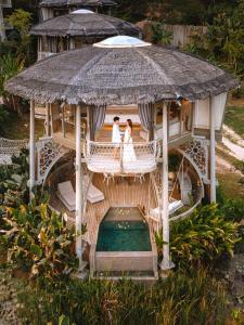 an aerial photo of a bride and groom in a gazebo at TreeHouse Villas - Adults Only in Ko Yao Noi