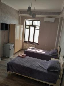 Кровать или кровати в номере Delfin Guest House