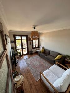 an aerial view of a living room with a couch at Historic Wooden House with Bosphorus view in Sarıyer