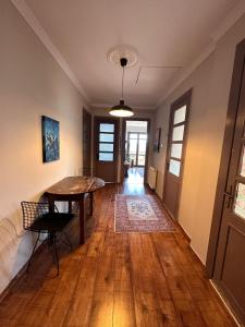 a living room with a table and a dining room at Historic Wooden House with Bosphorus view in Sarıyer