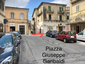 a street with cars parked on the side of the road at CasaNella in Lanciano