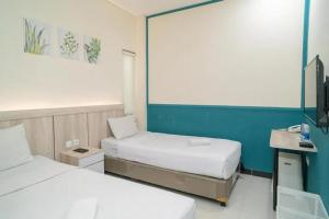 Een bed of bedden in een kamer bij Behomy 3C Residence near ICE BSD
