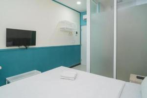 Een TV en/of entertainmentcenter bij Behomy 3C Residence near ICE BSD
