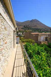 a balcony of a building with a view of a mountain at Mansion House in Neápolis