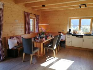a kitchen and dining room with a table and chairs at Lärchenhaus ,,Unterer Brodl" in Kammersberg +76 photos
