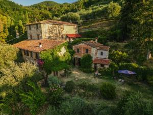 an aerial view of a house in a mountain at L'Orto dei Bruchi in Collodi