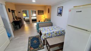 a room with a table and a bed in it at Condo Reina, Kusadasi in Kuşadası