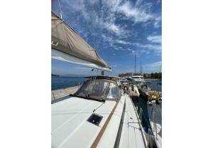 a sailboat docked at a dock in the water at Cyclades 32039ic in Corfu Town