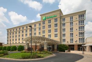 a hotel building with a sign on top of it at Holiday Inn Ardmore, an IHG Hotel in Ardmore