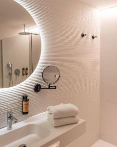 a bathroom with a sink and a mirror at Hotel Primavera Park in Benidorm +40 photos
