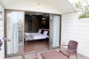 Postel nebo postele na pokoji v ubytování Hotel Pearls