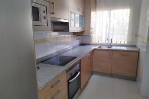 Kuchyňa alebo kuchynka v ubytovaní Apartamento Puertosol