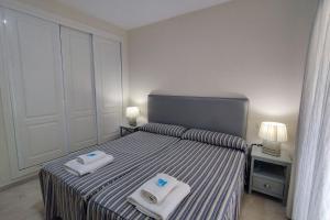 Posteľ alebo postele v izbe v ubytovaní Apartamento Puertosol