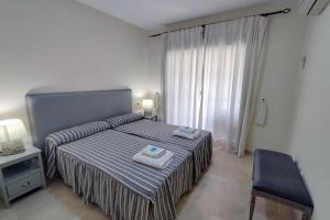 Posteľ alebo postele v izbe v ubytovaní Apartamento Puertosol + 32 fotografií