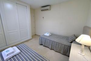 Posteľ alebo postele v izbe v ubytovaní Apartamento Puertosol