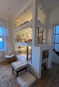 a bedroom with two bunk beds in a room at Rosa - Joss Bay in Kent