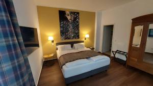 Postel nebo postele na pokoji v ubytování Hotel & Café KleinerGrünauer + 37 fotografií