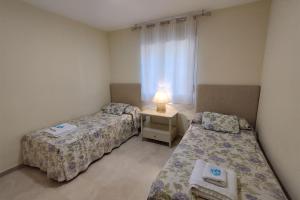 Posteľ alebo postele v izbe v ubytovaní Puertosol 2 + 37 fotografií