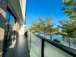 a balcony with a view of the water at Lightsview Entire Apt 9 KM from CBD in Broadview