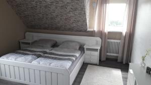 Posteľ alebo postele v izbe v ubytovaní Ferienwohnung Bergwiese
