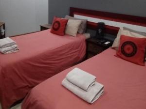 Postel nebo postele na pokoji v ubytování Grand Central Guesthouse