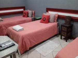 Postel nebo postele na pokoji v ubytování Grand Central Guesthouse