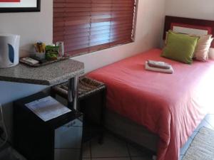 Postel nebo postele na pokoji v ubytování Grand Central Guesthouse