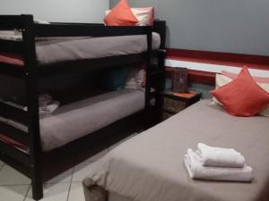 Postel nebo postele na pokoji v ubytování Grand Central Guesthouse