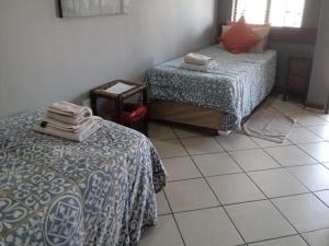 Postel nebo postele na pokoji v ubytování Grand Central Guesthouse
