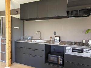 A kitchen or kitchenette at Mountain View Totoro - spacious & sunny