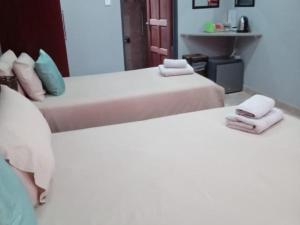 Postel nebo postele na pokoji v ubytování Grand Central Guesthouse