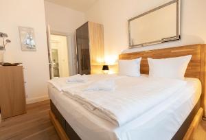 Ein Bett oder Betten in einem Zimmer der Unterkunft FIRST Avalon