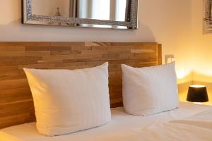Ein Bett oder Betten in einem Zimmer der Unterkunft FIRST Avalon
