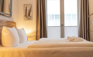 Ein Bett oder Betten in einem Zimmer der Unterkunft FIRST Avalon