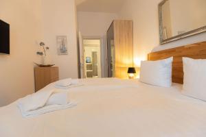 Ein Bett oder Betten in einem Zimmer der Unterkunft FIRST Avalon
