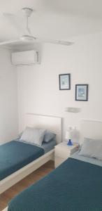 Posteľ alebo postele v izbe v ubytovaní Apartment IBIZA STYLE