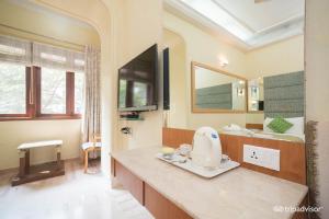 a large bathroom with a hair dryer on a counter at Regent Hotel in Mumbai +23 photos